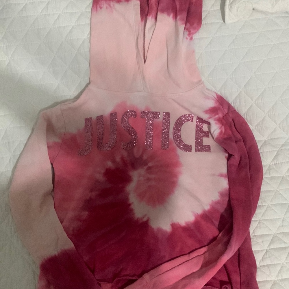 selling a  long sleeves that says justice on it.